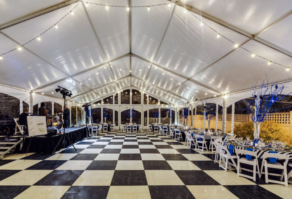 An interlocking dance floor installed in a tent